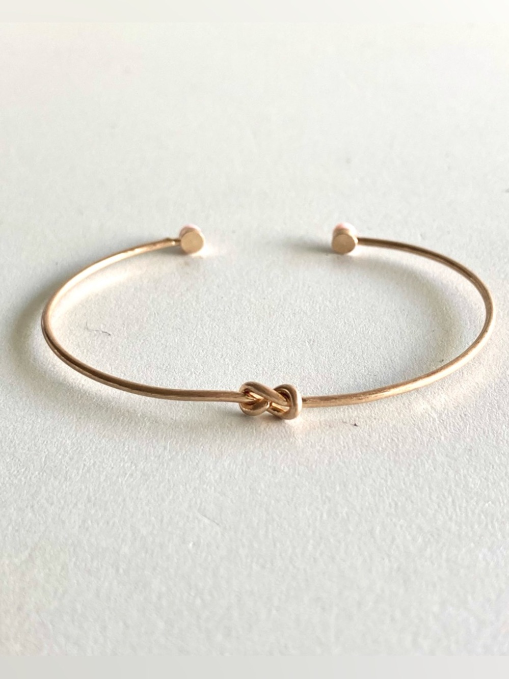 NWOT Delicate Gold tone Knot Open Cuff Bracelet